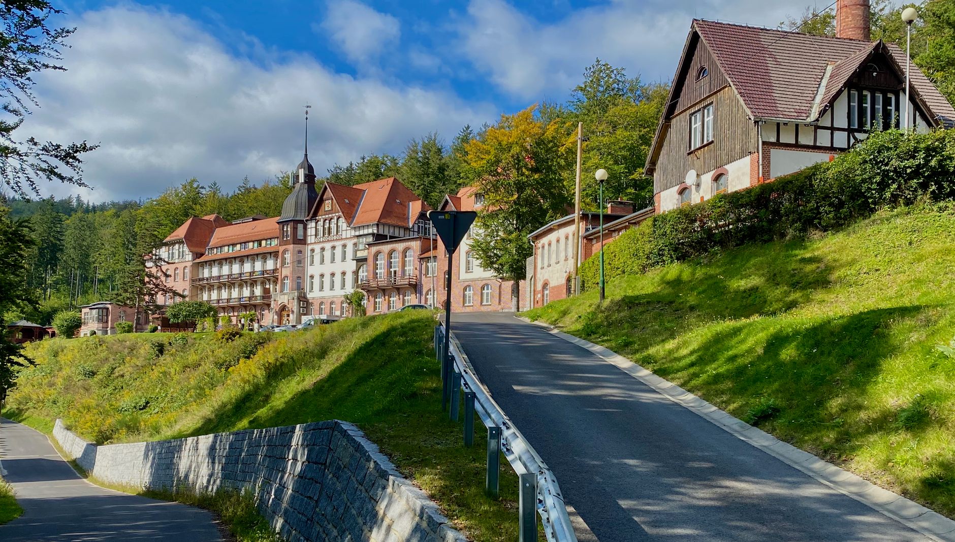 Charming historic building in Szklarska Poręba, Poland with lush greenery in a serene setting.