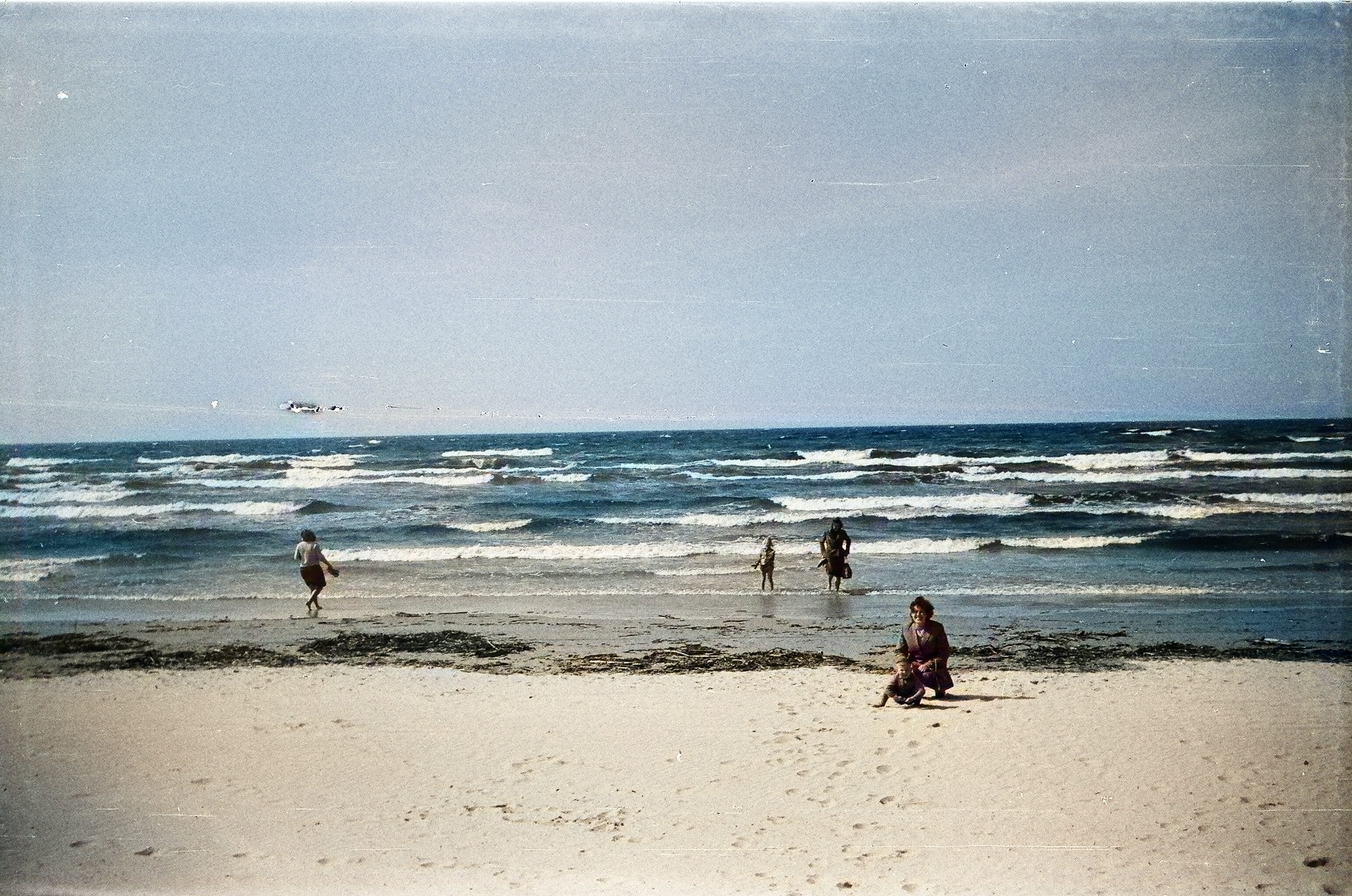 Enjoy a tranquil day at the picturesque beach in Ventspils, Latvia, capturing family moments by the sea.