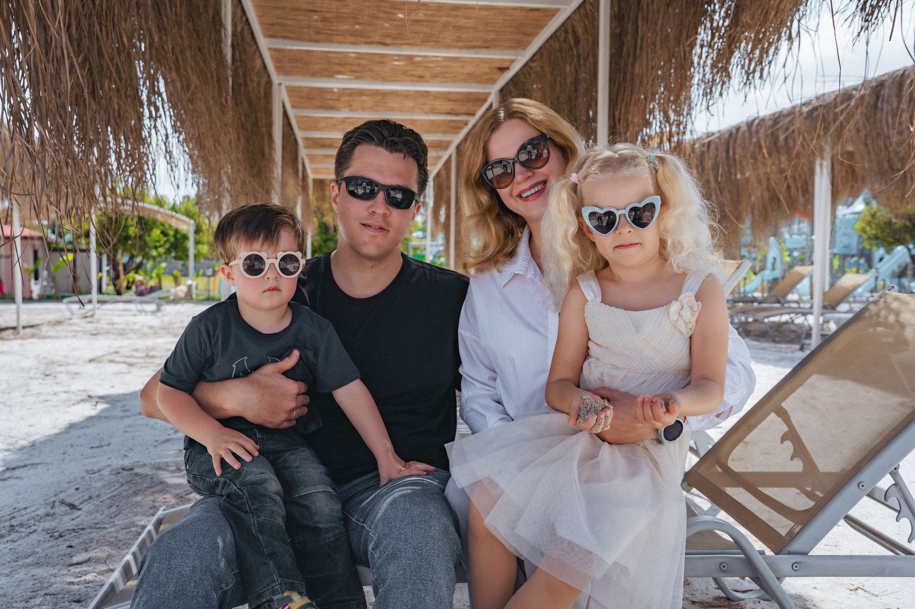 Family enjoying a sunny day on the beach in Kemer, Antalya, Türkiye.