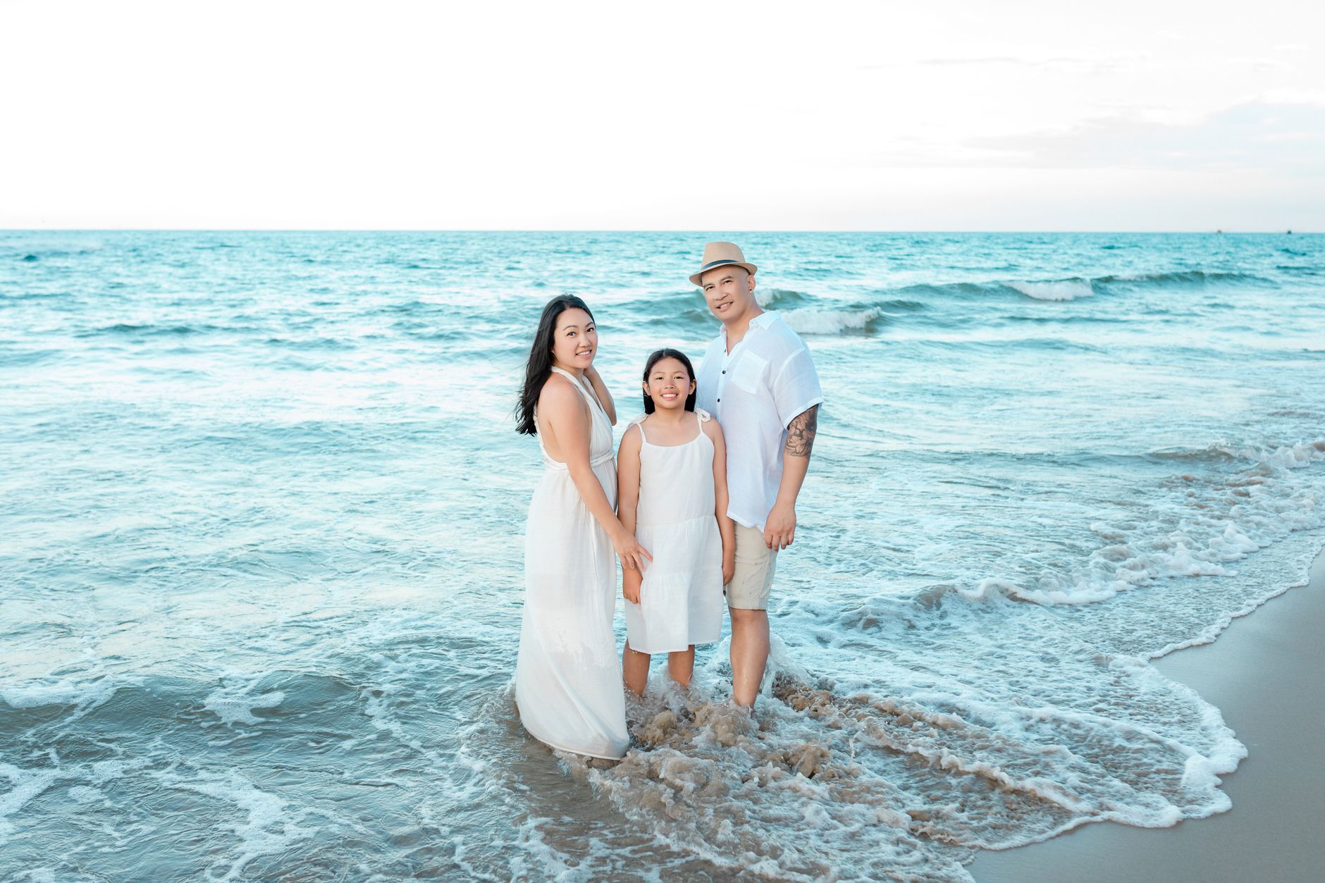 Family enjoying a day on the beach in Hội An, Vietnam. Perfect for lifestyle and travel themes.